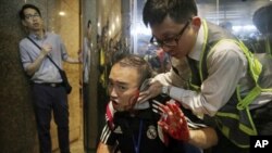 attacker bites politician's ear in hong kong