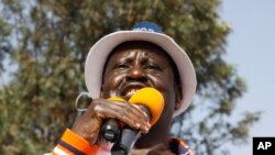 Kenyan opposition leader Raila Odinga addresses a crowd of his supporters in the Kibera area at an election rally in Nairobi, Kenya, Sept. 12, 2017. 