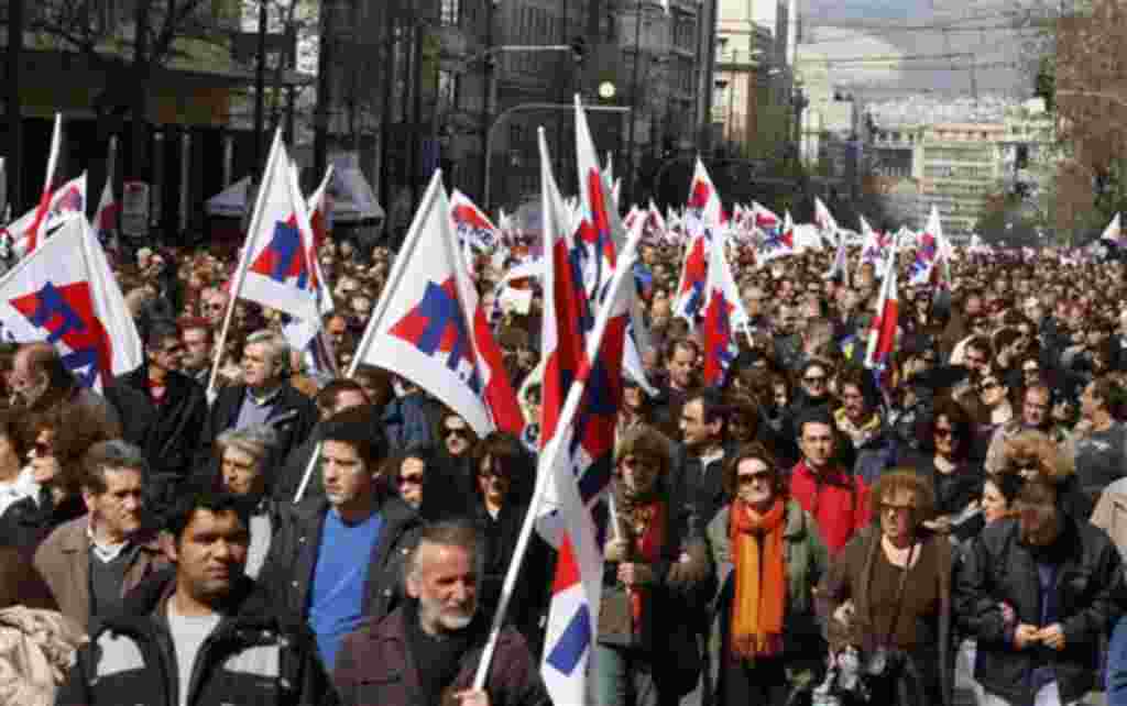 Protesters take part in a rally in Athens, Wednesday, Feb. 23, 2011. More than 30,000 protesters attended the Athens rally, which had been calm before the clashes. Protesters chanting "Don't obey the rich - Fight back!" marched to parliament as the city c