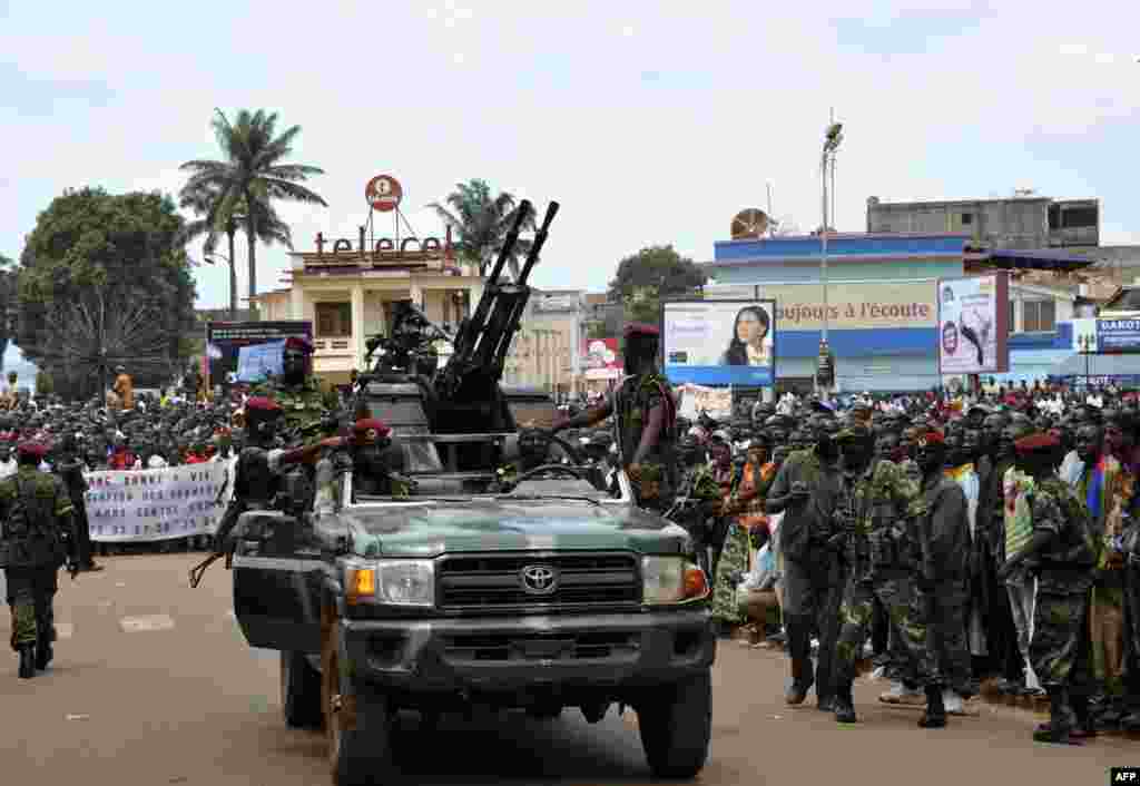 Rebel Seleka coalition soldiers arrive in Bangui. The Central African Republic&#39;s new strongman Michel Djotodia vowed not to contest 2016 polls and hand over power at the end of the three-year transition he declared after his coup a week ago.