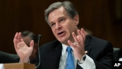 FBI Director Christopher A. Wray, testifies during a hearing of the Senate Committee on Homeland Security & Governmental Affairs, on Capitol Hill, Oct. 10, 2018, in Washington. 