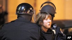 An Occupy Oakland protester is arrested by Oakland Police during an anti-police protest, in Oakland, California, January 28, 2012.