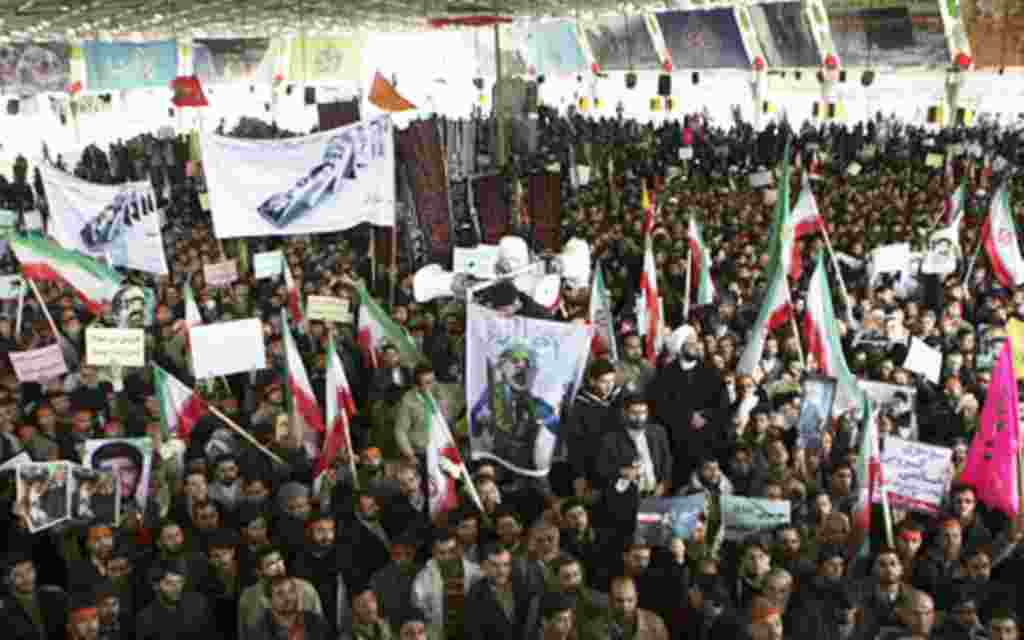 Iranians take part in the funeral of Sanee Zhaleh, a student who was shot dead during an opposition rally on in Tehran, February 16, 2011