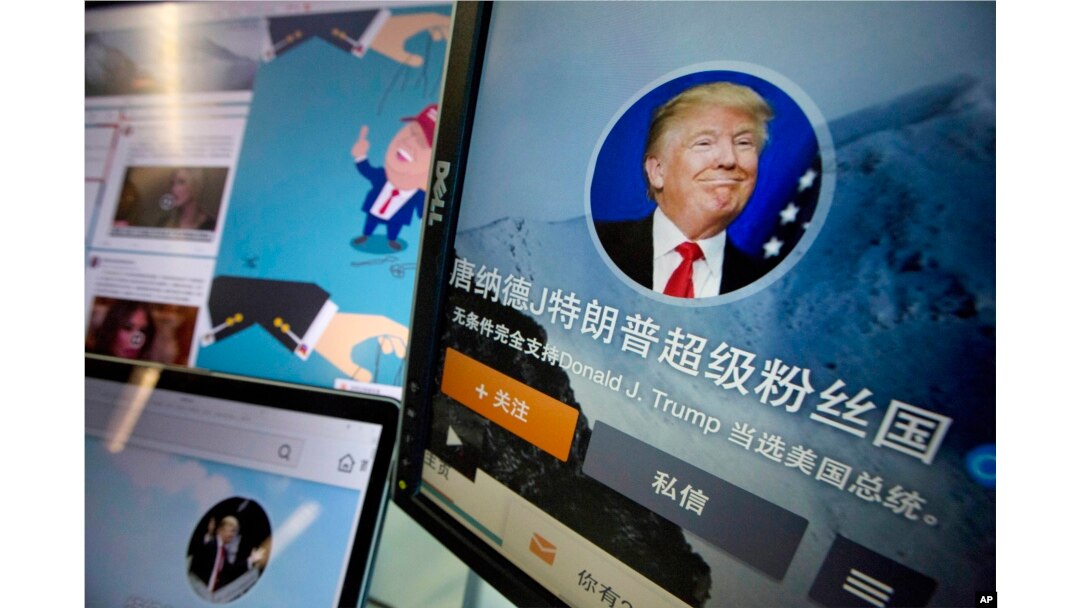 FILE - Chinese fan websites for Donald Trump are displayed on a computer with the words "Donald J. Trump super fan nation, Full and unconditional support for Donald J. Trump to be elected U.S. president" in Beijing, China, May 18, 2016.