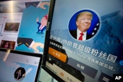 FILE - Chinese fan websites for Donald Trump are displayed on a computer with the words "Donald J. Trump super fan nation, Full and unconditional support for Donald J. Trump to be elected U.S. president" in Beijing, China, May 18, 2016.