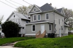 The two-story duplex in Waterloo, Iowa, May 1, 2020, where two tenants died within days of each other from COVID-19.