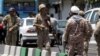 FILE - Members of the Iranian Revolutionary Guard are seen in Tehran, June 7, 2017.