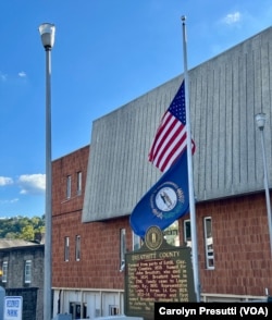 Flags in nearby Jackson, Kentucky, fly at half-staff following the death of District Judge Kevin Mullins in Letcher County. The local sheriff is charged with murder.