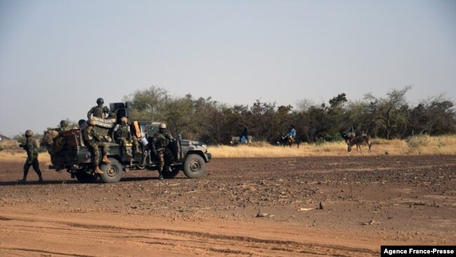 FILE - A detachment of anti-jihadist Special Forces elements patrol on Nov. 6, 2021, in the Tillaberi region (western Niger), the scene of deadly actions by suspected jihadists since the beginning of the year.