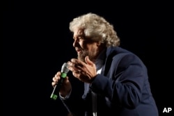 FILE - Five Stars Movement party leader Beppe Grillo speaks at a rally on constitutional reforms, in Rome, Italy, Nov. 26, 2016.