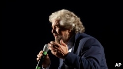 Five Stars Movement party leader Beppe Grillo speaks at a rally on constitutional reforms, in Rome, Italy, Nov. 26, 2016. He has called Italy under Prime Minister Matteo Renzi "a country that’s stuck in the mud."