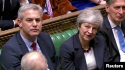 La Première ministre britannique Theresa May, après les résultats du vote sur les options alternatives du Brexit au Parlement à Londres, le 27 mars 2019. Reuters TV .