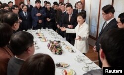 South Korean President Park Geun-hye speaks during a meeting with reporters at the Presidential Blue House in Seoul, South Korea, in this handout picture provided by the Presidential Blue House and released by Yonhap, Jan. 1, 2017.