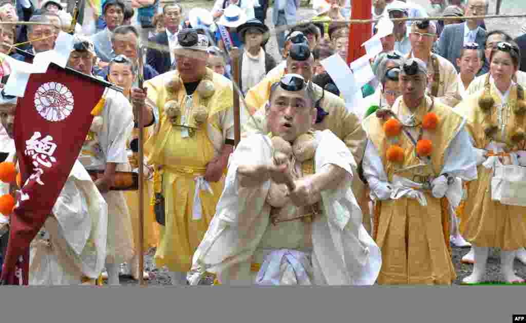 Yamabushi or Japanese Buddhist monks in the mountains hold a ceremony of official opening of Mount Fuji climbing season at Murayama Sengen Shrine in Fujinomiya, Shizuoka prefecture.