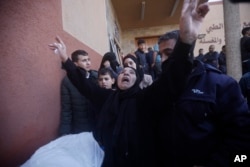 Palestinians attend a funeral of their relatives killed in the Israeli bombardment of Gaza in Khan Younis on Dec. 6, 2023.