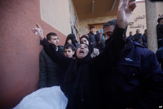 Palestinians attend a funeral of their relatives killed in the Israeli bombardment of Gaza in Khan Younis on Dec. 6, 2023.