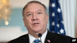 FILE - In this Nov. 24, 2020, file photo, Secretary of State Mike Pompeo speaks to the media prior to meeting with Kuwaiti Foreign Minister Sheikh Ahmad Nasser Al-Mohammad Al-Sabah at the State Department in Washington. The State Department said…