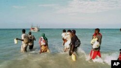 People waiting to board a boat to take them across the Gulf of Aden (file photo)