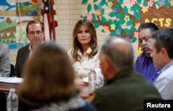 U.S. first lady Melania Trump and U.S. Secretary of Health and Human Services Alex Azar (L) listen during a roundtable meeting at the Lutheran Social Services of the South "Upbring New Hope Children's Center" near the U.S.-Mexico border in McAllen