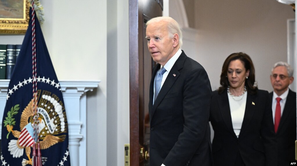 US President Joe Biden, Vice President Kamala Harris, and Attorney General Merrick Garland arrive in the Roosevelt Room of the White House in Washington, DC, on July 14, 2024.