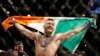 Conor McGregor réagit après avoir vaincu Jose Aldo lors d'un combat d'arts martiaux mixtes de championnat poids plume à l'UFC 194 à Las Vegas, le 12 décembre 2015.