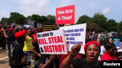 FILE: Ghanaians march in the streets on the second day of protests over recent economic hardships, in Accra, Ghana, 6.29.2022