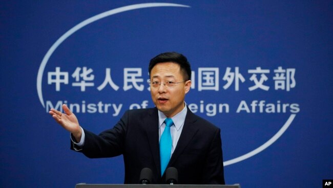 FILE - Chinese Foreign Ministry new spokesman Zhao Lijian speaks during a daily briefing at the Ministry of Foreign Affairs office in Beijing, Feb. 24, 2020.