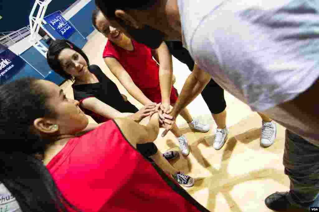 The girls’ basketball team regularly plays games against teams of grown ups. It came from behind to win this match. (John Owens for VOA)