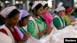 Women work at Goldtex Limited garment factory inside the Dhaka Export Processing Zone (DEPZ) in Savar, April 11, 2013. 