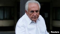 Former IMF head Dominique Strauss-Kahn enters his car as he leaves his apartment in Paris, France, June 12, 2015. 