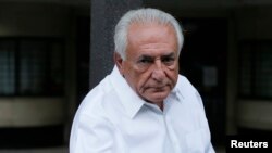 Former IMF head Dominique Strauss-Kahn enters his car as he leaves his apartment in Paris, France, June 12, 2015.