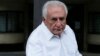 Former IMF head Dominique Strauss-Kahn enters his car as he leaves his apartment in Paris, France, June 12, 2015. 