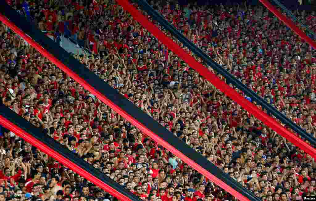 Football fans cheer during the CAF Champions League semi-final football match between Al Ahly and Etoile du Sahel at the Borg El Arab Stadium in Alexandria, Egypt, Oct. 22, 2017.