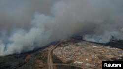 A Canadian Joint Operations Command aerial photo shows wildfires near Fort McMurray, Alberta, in this image posted on twitter on May 5, 2016, courtesy CF Operations.