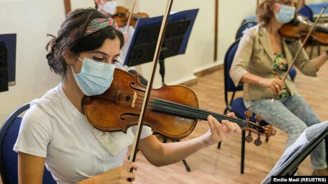 A musician from Lebanon's national orchestra playing during practice in Beirut, Lebanon on November 2, 2021. (Reuters/Emilie Madi)