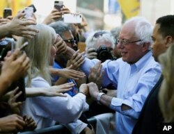 FILE - Democratic presidential candidate Bernie Sanders, I-Vt., participates in a rally alongside unions, hospital workers and community members against the closure of Hahnemann University Hospital in Philadelphia, July 15, 2019.