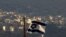 FILE - An Israeli flag flies near the village of Majdal Shams in the Golan Heights, Oct. 11, 2018.
