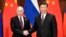 시진핑 중국 국가 주석(오른쪽)과 블라디미르 푸틴 러시아 대통령이 26일 중국 베이징에서 만나 정상회담을 했다. 