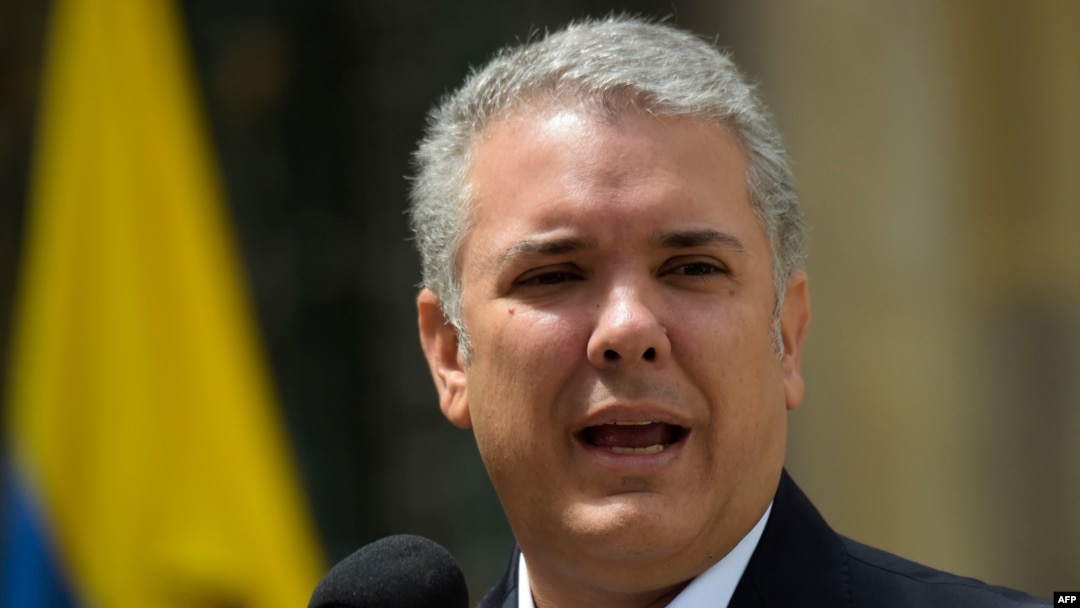 Colombian President Ivan Duque speaks after voting during a popular consultation on measures including cutting congressional salaries and boosting sentences for corruption, in Bogota on Aug. 26, 2018. 