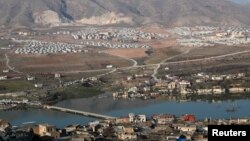 A bridge over the Tigris River which connects Hasankeyf to the other side of the river is seen nearly submerged by the waters of Ilisu Dam in Turkey, February 20, 2020. Picture taken February 20, 2020. REUTERS/Murad Sezer