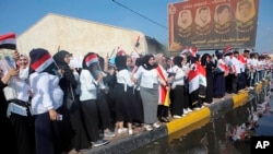 Students take part in an anti-government demonstration in Basra, Iraq, Oct. 28, 2019.