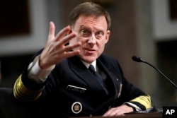 FILE - National Security Agency and U.S. Cyber Command Director Adm. Mike Rogers testifies on Capitol Hill in Washington, May 9, 2017.