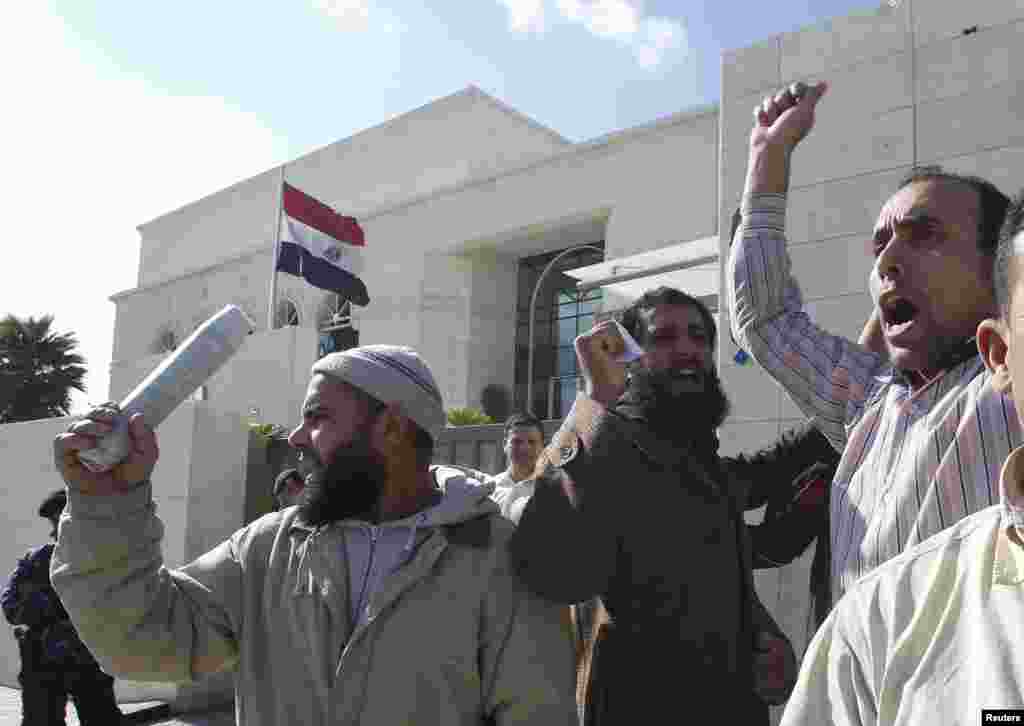 Egyptians shout pro-Egyptian President Mohamed Morsi slogans outside the Egyptian embassy in Amman December 12.