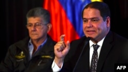 FILE - The president of the Foreign Affairs Committee of the Venezuelan National Assembly, Deputy Luis Florido (R), speaks during a press conference next to the president of the Venezuelan National Assembly, Henry Ramos Allup, in Caracas, Sept. 12, 2016.