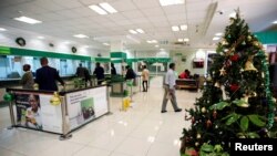 FILE - A Christmas tree is placed inside a banking hall of Consolidated Bank along Koinange Street in Nairobi, Dec. 10, 2018.