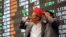 Filipino traders blow horns during the last trading day of the year at the Philippine Stock Exchange in the financial district of Makati, south of Manila, Philippines, Dec. 29, 2016. 