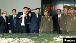 North Korean envoy Choe Ryong Hae, center right, tours Beijing Economic-Technological Development Area, an industrial park in the southern part of Beijing, May 23, 2013.