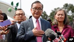 Cambodia's exiled opposition leader Sam Rainsy talks to the media outside Parliament House in Kuala Lumpur, Malaysia, Tuesday, Nov. 12, 2019. 