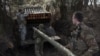 Ukrainian service members of the 68th Jaeger Brigade named after Oleksa Dovbush load a rocket into a BM-21 Grad multiple launch system at their position near the frontline town of Pokrovsk, in Donetsk region, Feb. 14, 2025. 