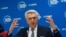 FILE - U.N. High Commissioner for Refugees Filippo Grandi holds press conference on first day of Global Refugee Forum, in Geneva.